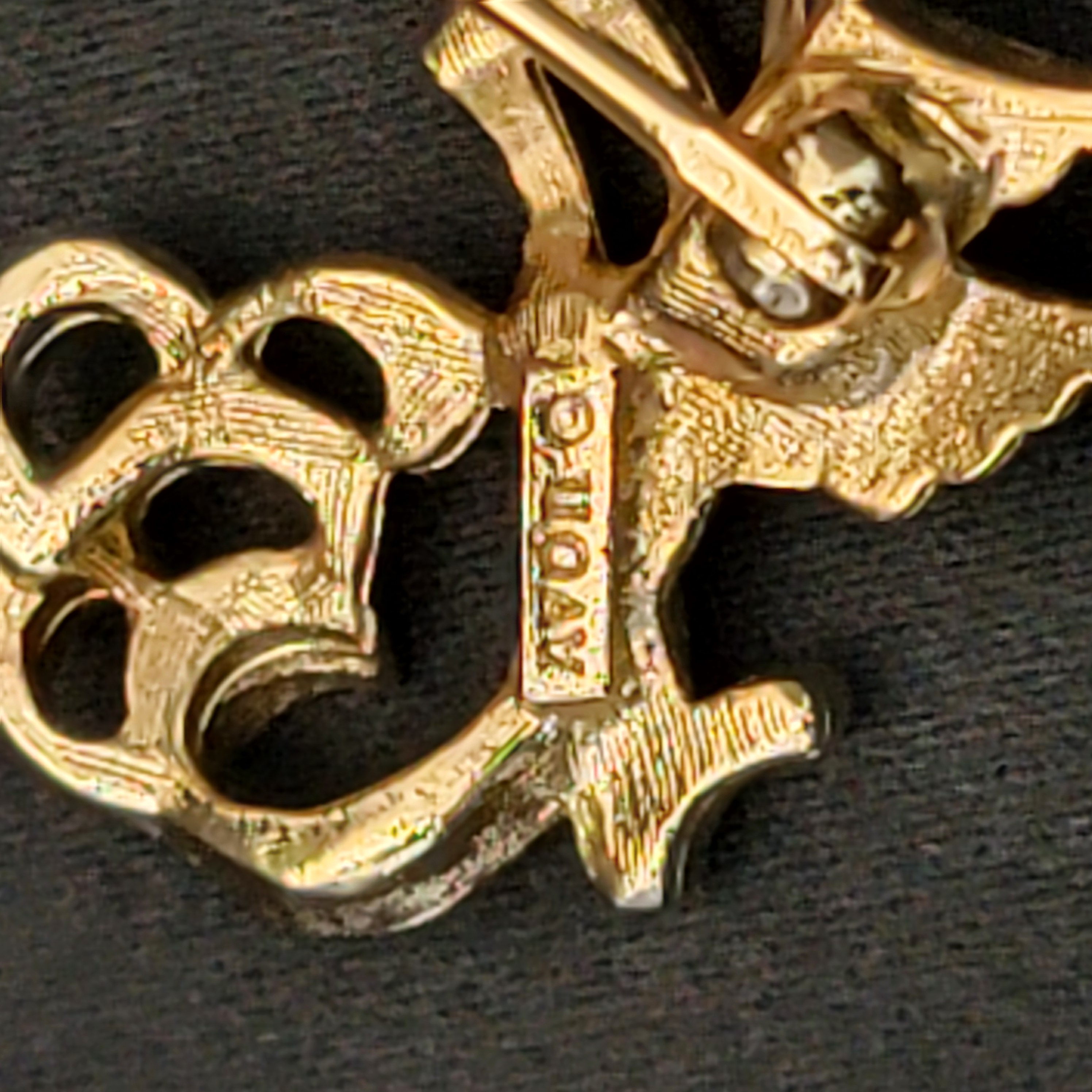 Back view with AVON signature and clasp